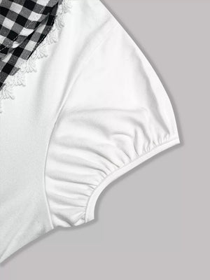White maternity shirt with black gingham collar and lace trim.