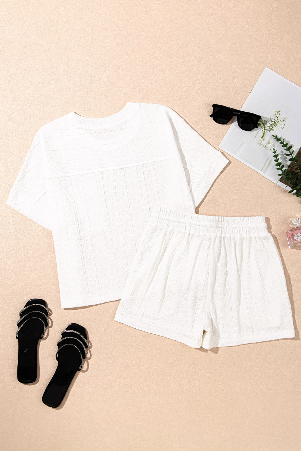 White textured knit drawstring short set with a relaxed fit top and shorts.