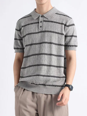 Men's gray knit polo with black horizontal stripes and button accents.