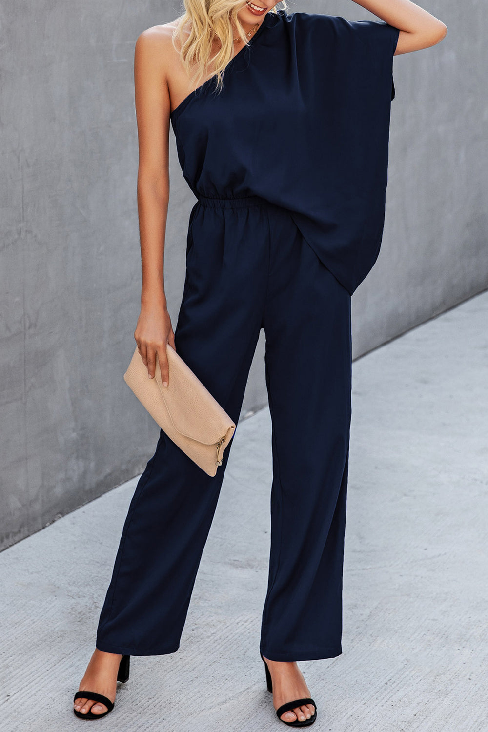 Dark blue asymmetric drape-sleeve wide-leg jumpsuit with elastic waist