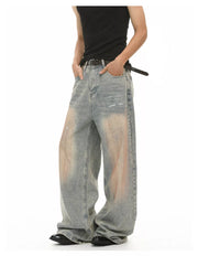 Relaxed fit vintage wash jeans in blue denim with distressed details and a baggy cut.
