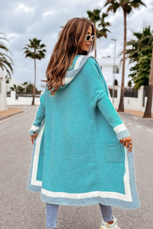 Color-blocked hooded knit maxi cardigan in Tiffany Blue with white and gray trim.