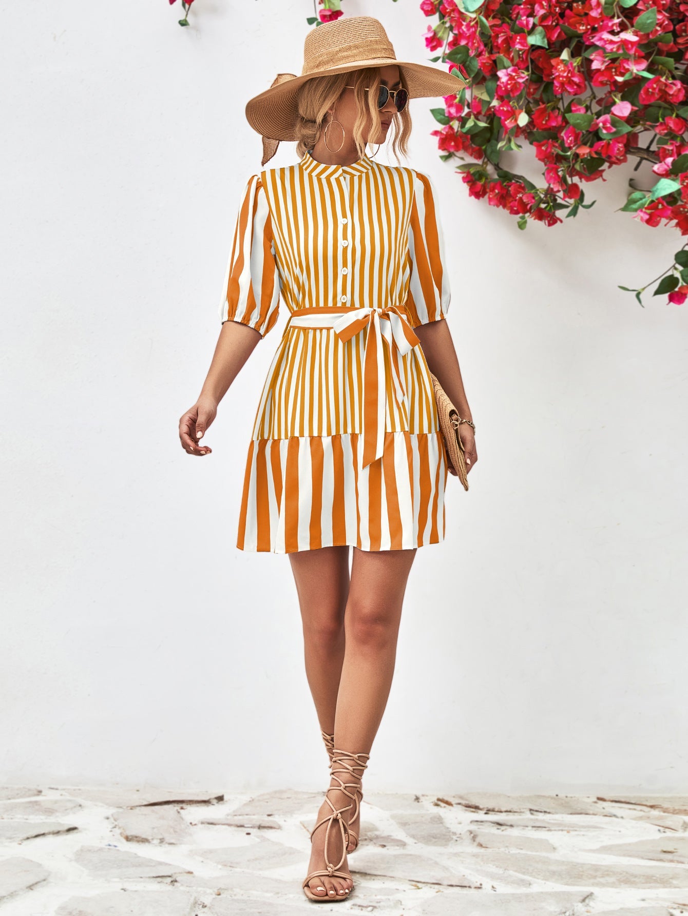 Gold vertical stripe shirred waist dress with tie belt and puff sleeves.
