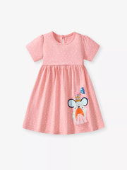 Blush pink polka dot toddler dress with a cartoon mouse applique and short puff sleeves.