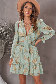 Gum Leaf floral print tie-front mini dress with smocked waist and ruffled hem.