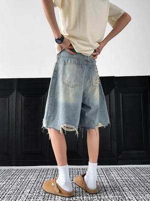 Light-wash distressed denim shorts with raw hem and ripped details.