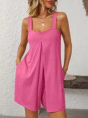 Hot pink pleated bodice pocketed romper with wide straps and v-neckline.