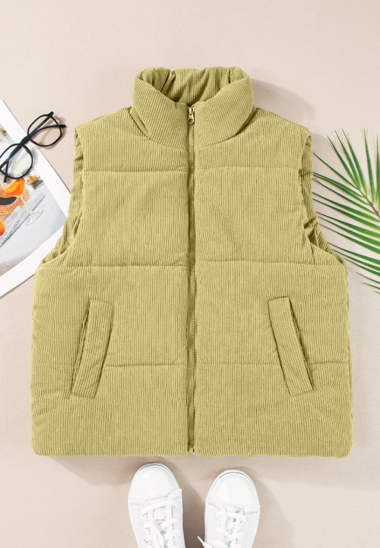 Corduroy padded vest in sage with a stand-up collar and zip front.
