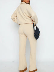 Ribbed knit lounge set in tan featuring quarter-zip top and flared pants.
