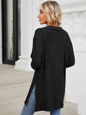Black ribbed knit collared tunic top with slit hem and long sleeves.