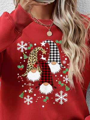 Red raglan sweatshirt with festive gnome graphic, snowflakes, and holly.