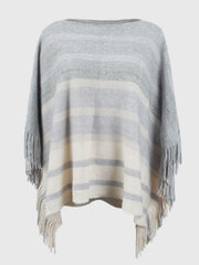 Striped knit poncho in ivory and charcoal with a boat neck and fringe trim.
