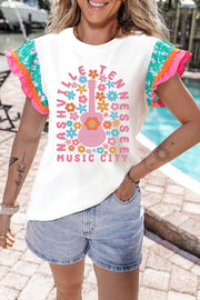 White graphic tee with ruffle sleeves, featuring a pink guitar and floral "Nashville Tennessee Music City" print.