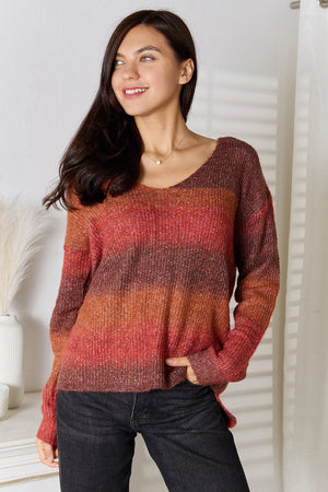 Sunset Stripe Slouchy V-Neck Knit sweater in Brick Red acrylic with ombre stripes and a relaxed fit.