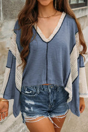 Textured patchwork tunic top in Dusty Blue with V-neck and crochet sleeves.