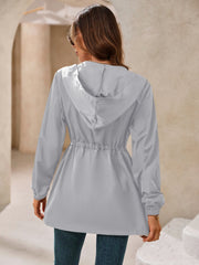 Gray hooded jacket with cinched waistline and elastic cuffs.