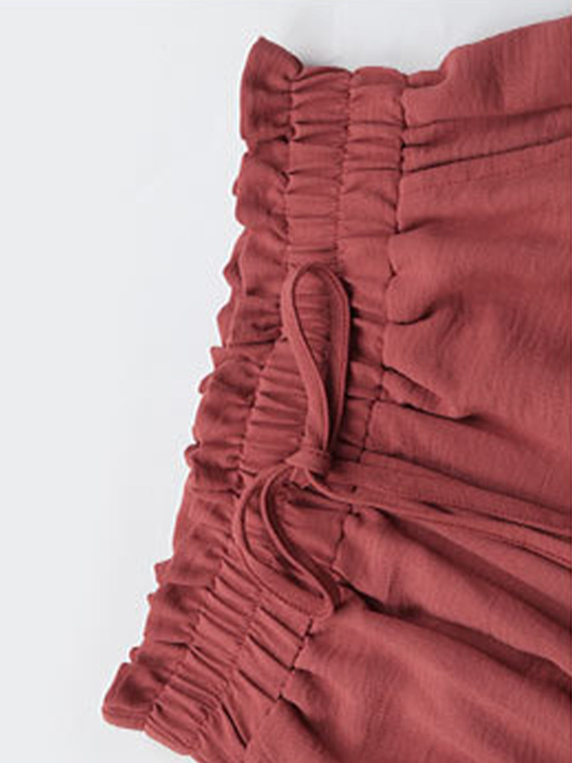 Rust palazzo trousers with ruffled elastic waist and drawstring detail