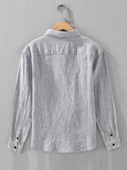 Grey linen textured long sleeve button-up shirt with button cuffs.