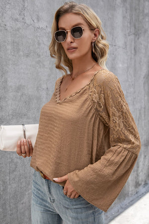 Camel lace sleeve blouse with scallop trim neckline and bell sleeves.