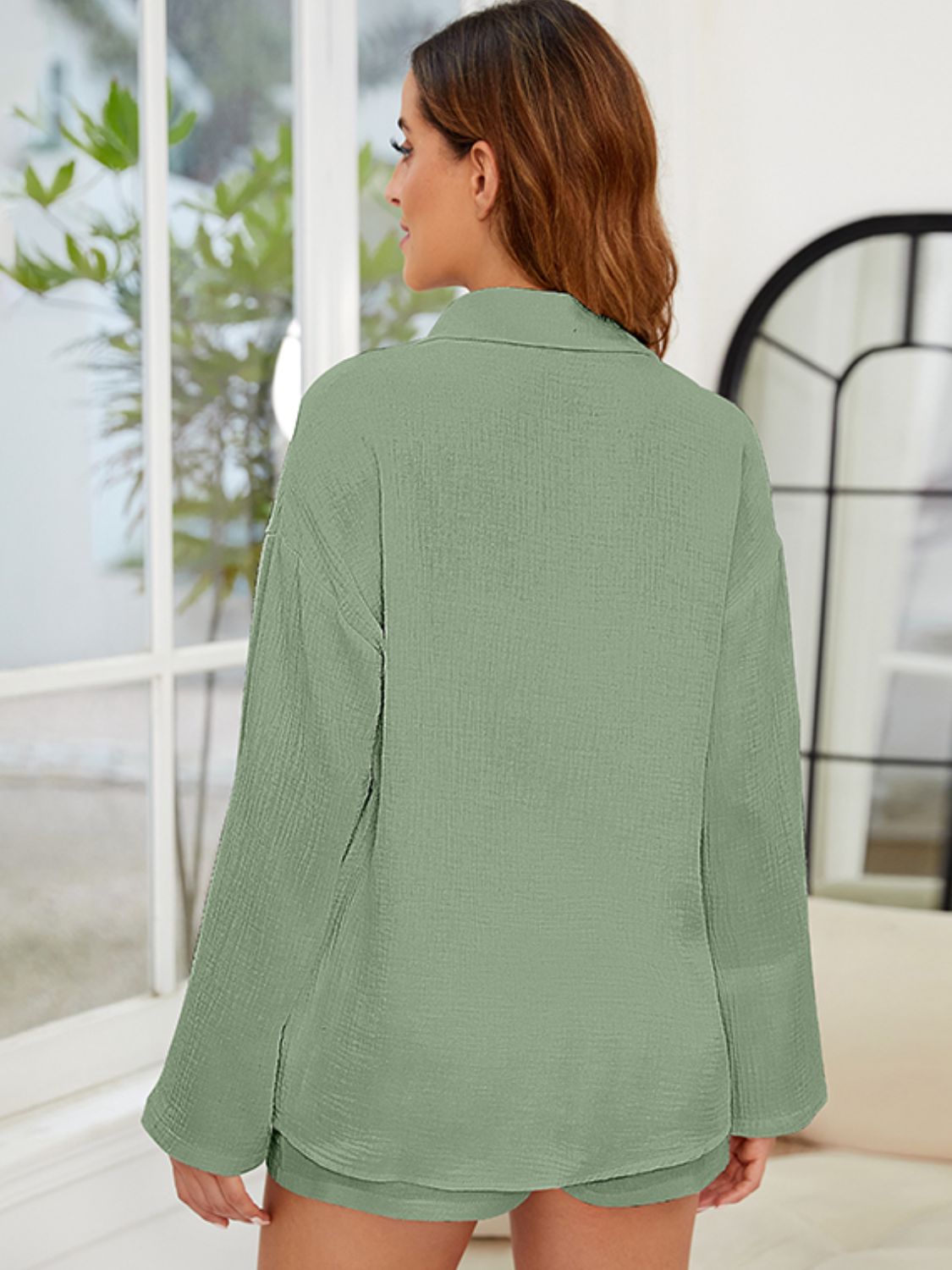 Textured cotton co-ord set in Matcha Green, featuring a relaxed button-up shirt with long sleeves and shorts.