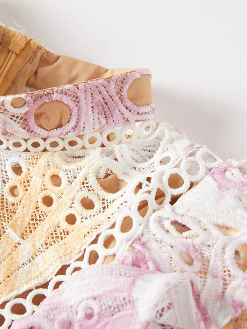 Luxe floral lace maxi gown detail with pink, purple, and yellow accents.
