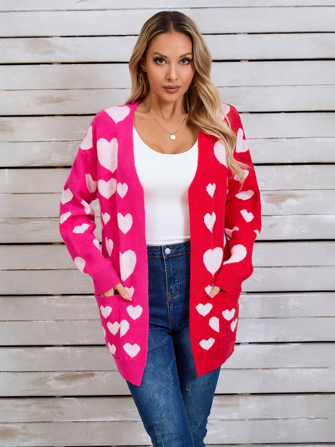Heartbeat split-panel open cardigan in pink and red with white hearts, acrylic blend, featuring pockets.