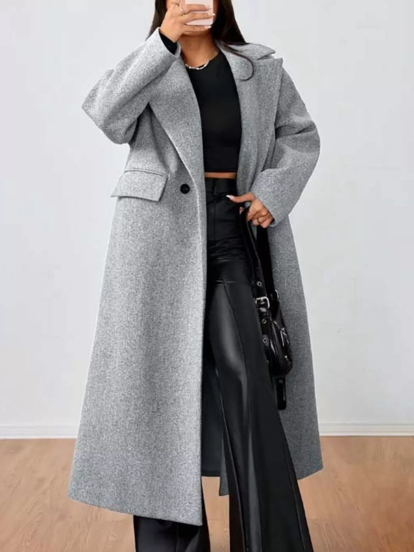 Longline gray wool-blend overcoat with button closure and flap pockets.