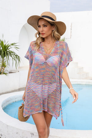 Open-knit pastel beach cover-up with V-neck and short sleeves, acrylic blend.