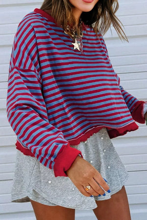 Striped sweatshirt with red and blue stripes, crew neck, and contrast red trim.