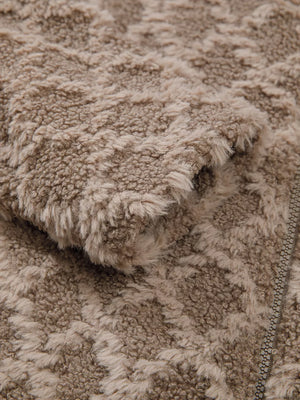 Textured sherpa fleece hooded jacket in tan with a subtle geometric pattern and zipper detail.