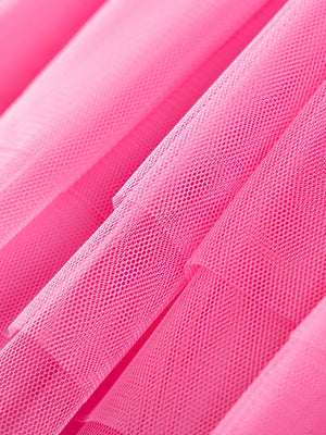 Pink tulle toddler dress fabric detail, showing mesh texture.
