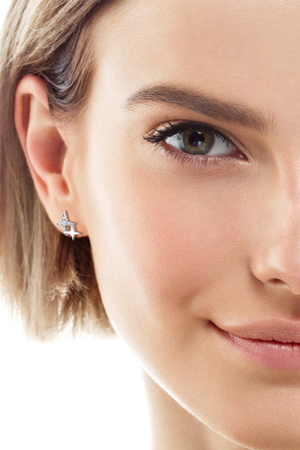 Celestial diamond burst stud earrings in silver with sparkling details.
