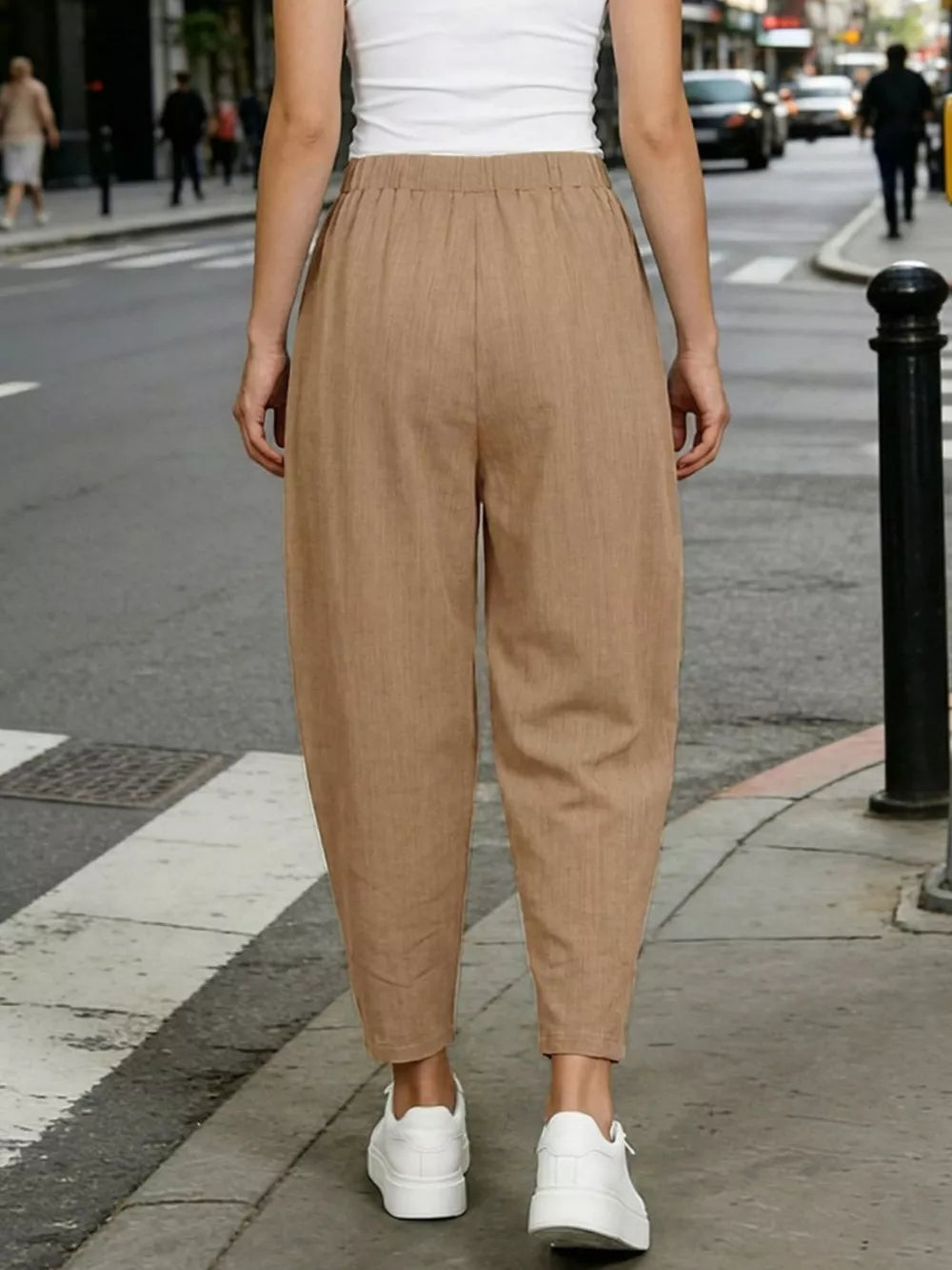 Camel harem maternity joggers with elastic waist and pockets, styled with white sneakers.