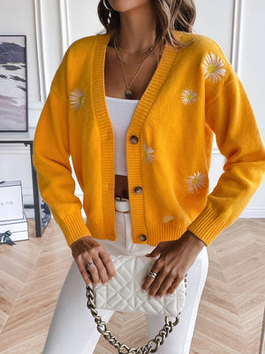 Gold button-down cardigan with embroidered daisies and ribbed trim.