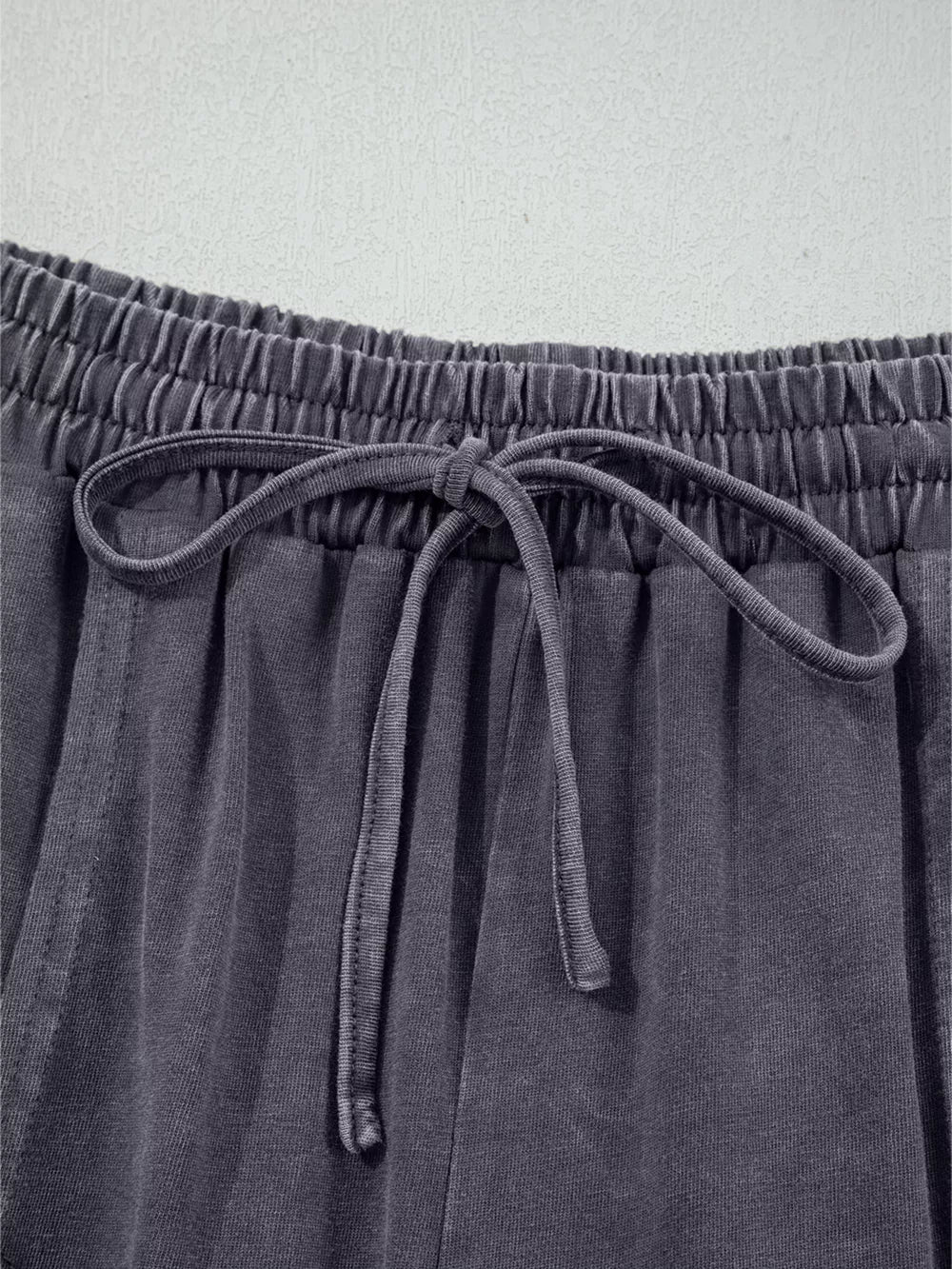 Maternity cropped wide-leg cotton pants in charcoal grey with drawstring waist and elastic waistband.