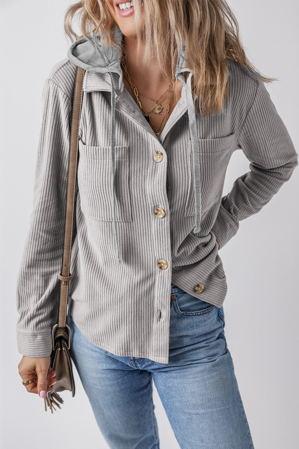 Gray corduroy shirt jacket with contrast hood, button front, and chest pockets.