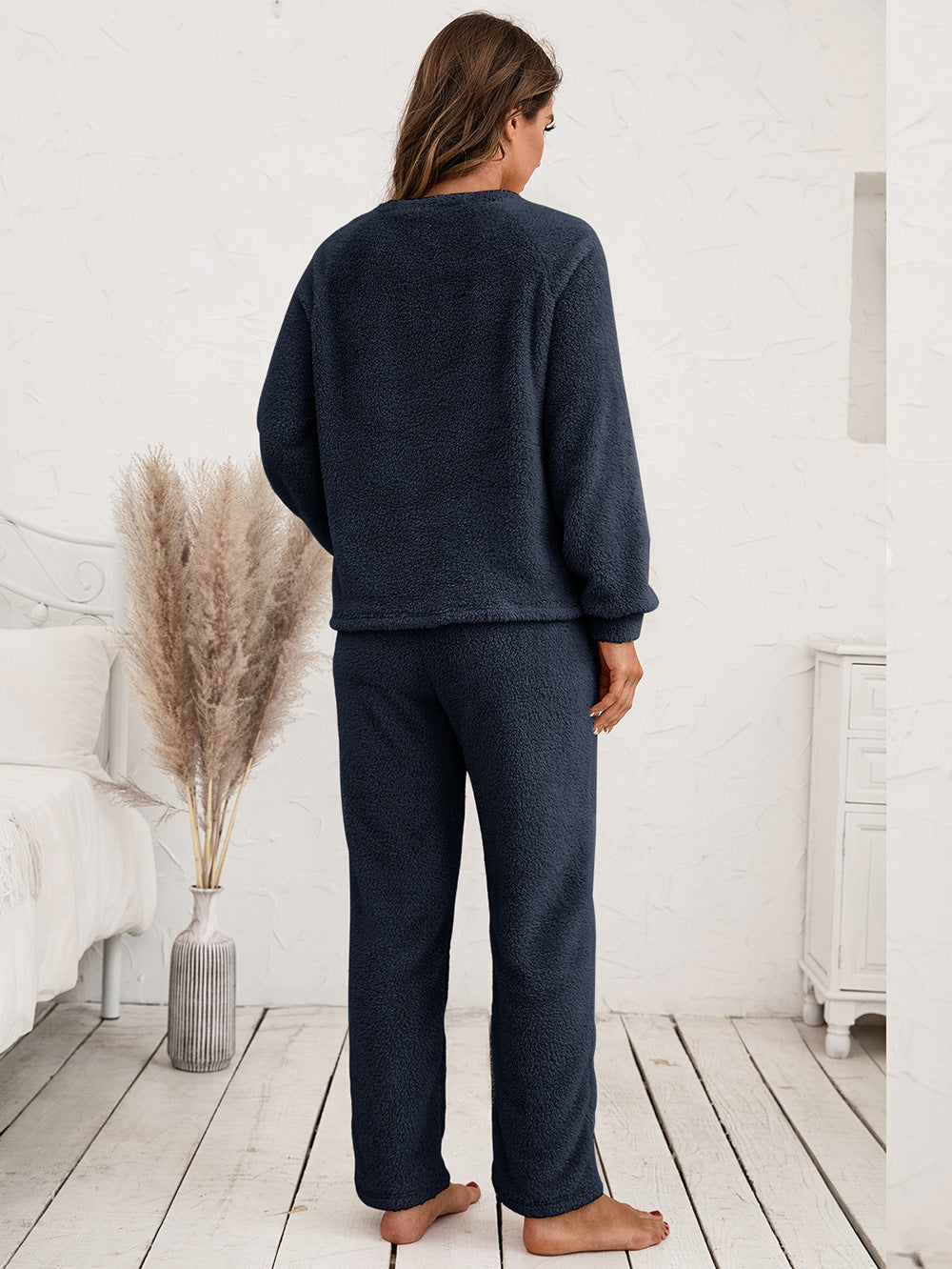 Plush loungewear set in dark blue with raglan sleeves and relaxed fit pants.