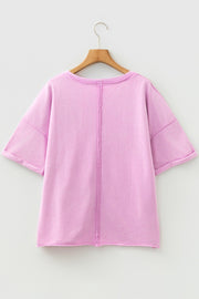 Pink cotton crew neck t-shirt with rolled sleeves and contrast stitching detail.