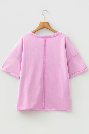 Pink cotton crew neck t-shirt with rolled sleeves and contrast stitching detail.