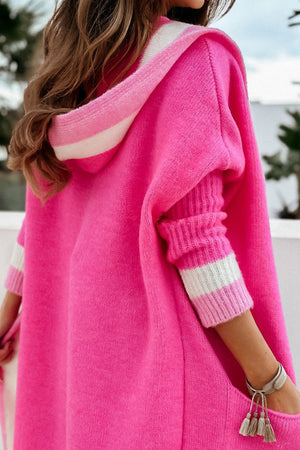 Hot Pink hooded knit maxi cardigan with white stripe details on hood and cuffs.