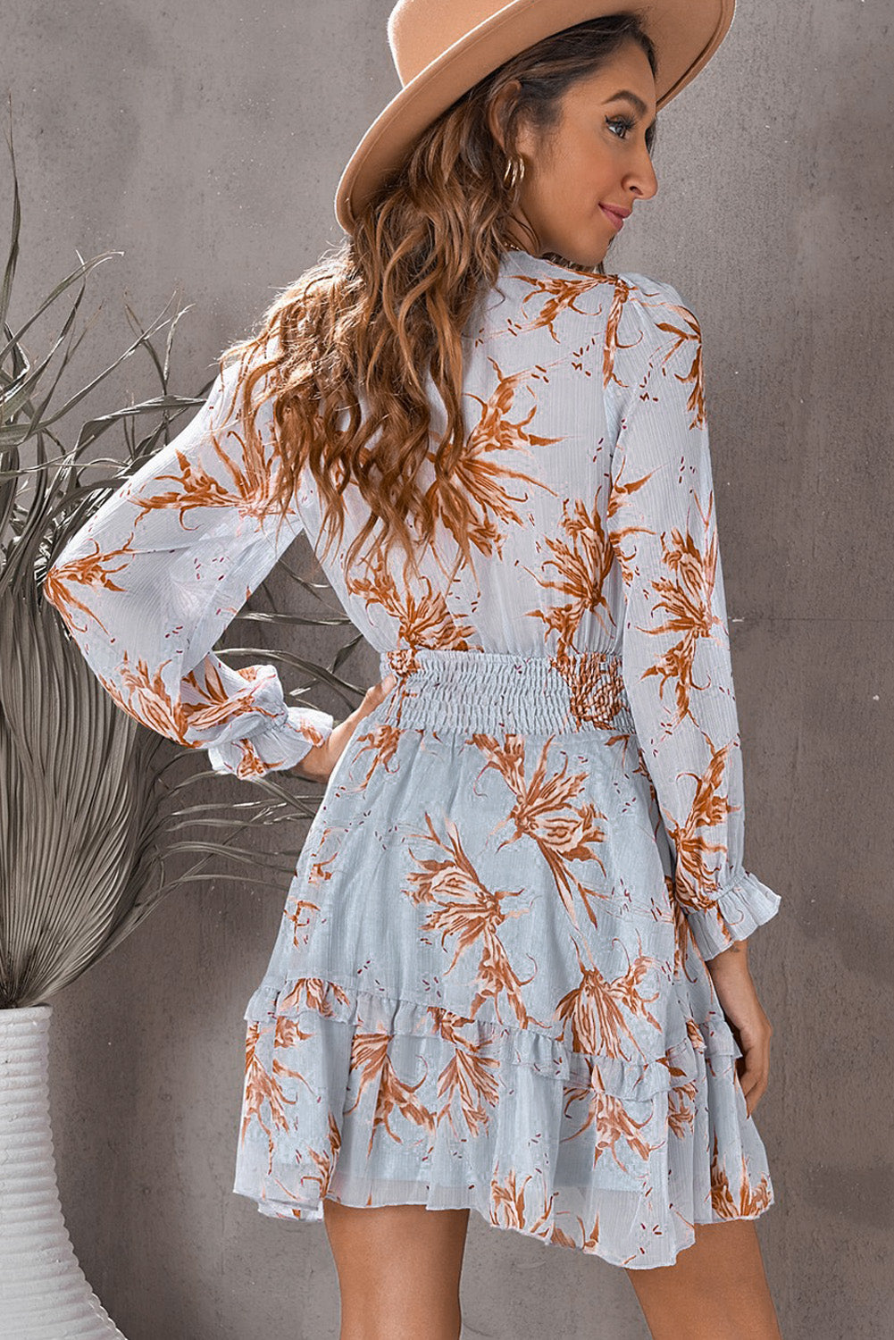 Light Mauve floral print mini dress with smocked waist and ruffled hem.