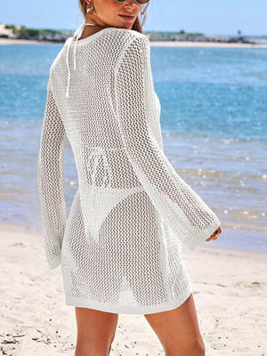 White openwork knit cover-up dress with keyhole detail and long sleeves.