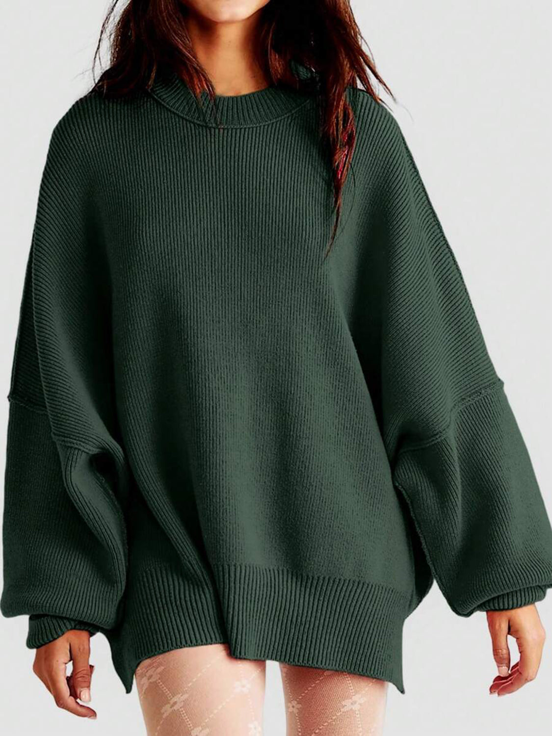 Oversized ribbed knit sweater in dark green with drop shoulders and crew neck.