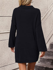 Black ribbed knit polo dress with long sleeves and pockets, acrylic fabric.