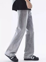 Men's relaxed fit light grey washed cotton jeans with a vintage-inspired look.