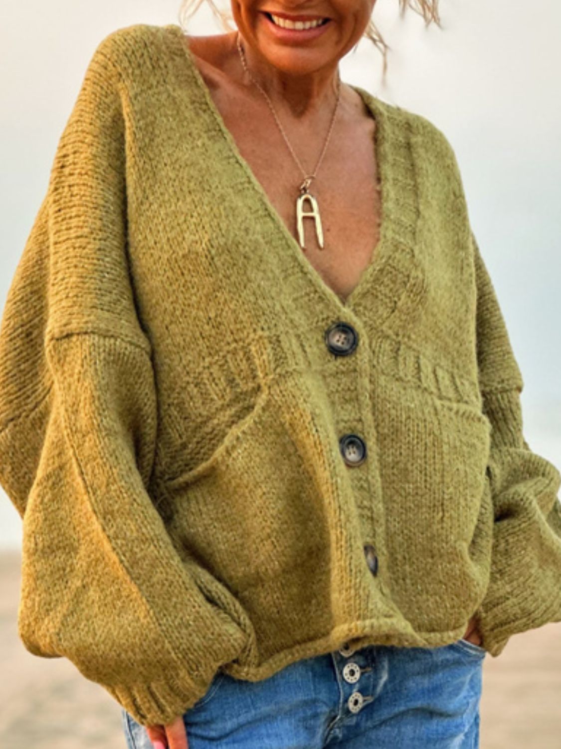 Textured bouclé oversized button-down cardigan in lime with V-neck and patch pockets.