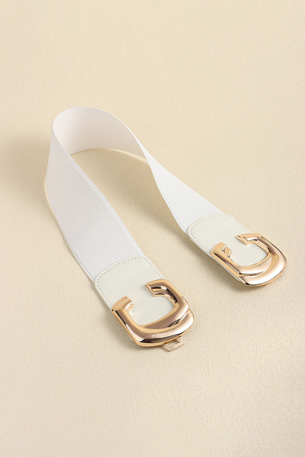 White elastic belt with double C gold buckle and faux leather trim