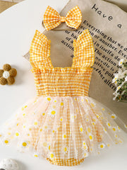 Yellow gingham baby one-piece with smocked bodice, ruffled straps, daisy-print tulle skirt and matching bow headband.