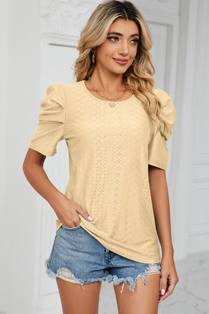 Perforated puff sleeve top in light yellow with a diamond pattern, crew neck, and short sleeves.