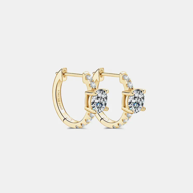 Gold pavé-set moissanite huggie hoop earrings with a central square-cut stone.